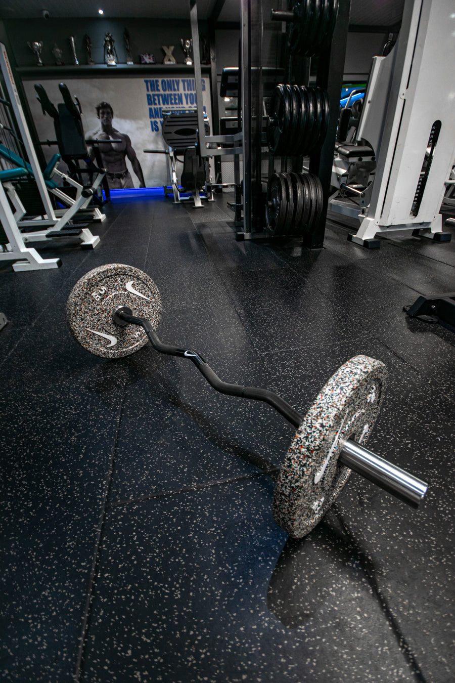EZ-curl bar loaded with Nike plates at Mas Body Gym Middlesbrough