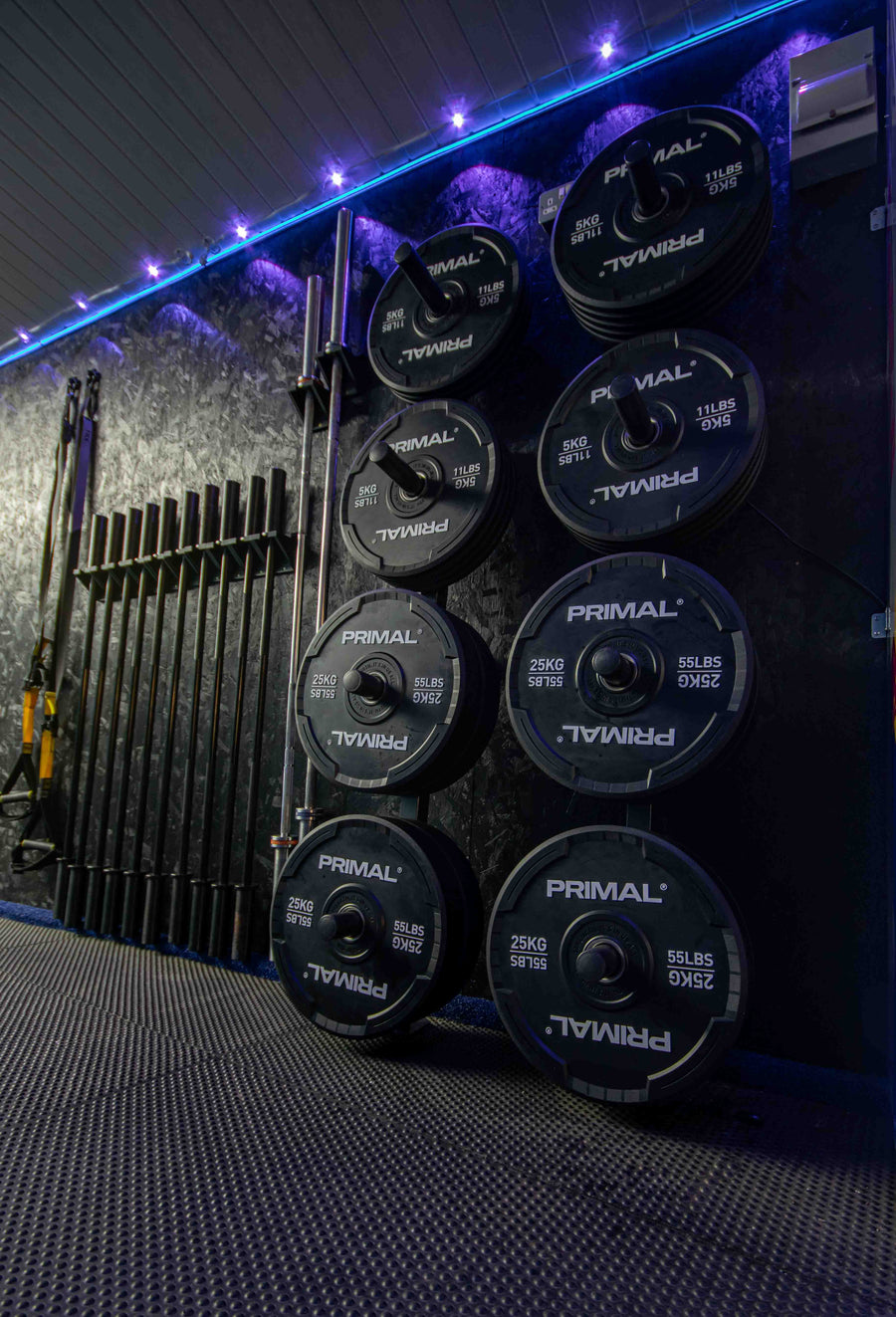 Primal Olympic plates racked on the wall at Mas Body Gym Middlesbrough