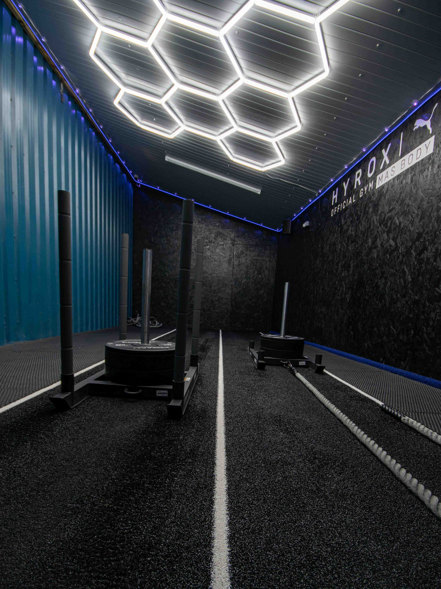Two official CenterX HYROX sleds on the marked lane at Mas Body Gym Middlesbrough